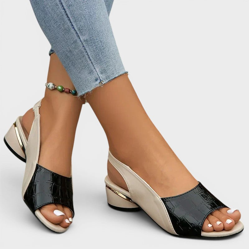 Women's peep-toe wedge sandals in red with an open toe and secure ankle strap