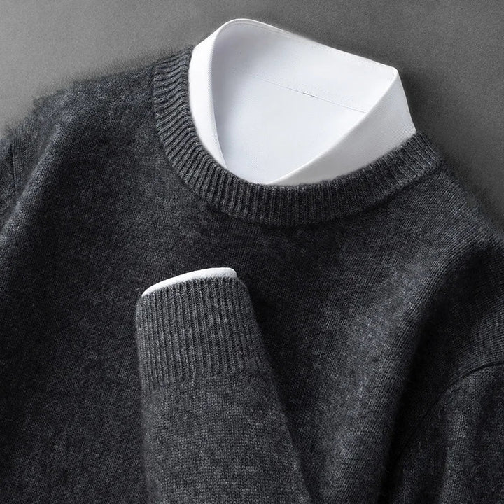 A woman wearing a soft warm jumper layered over a shirt on a cold day.