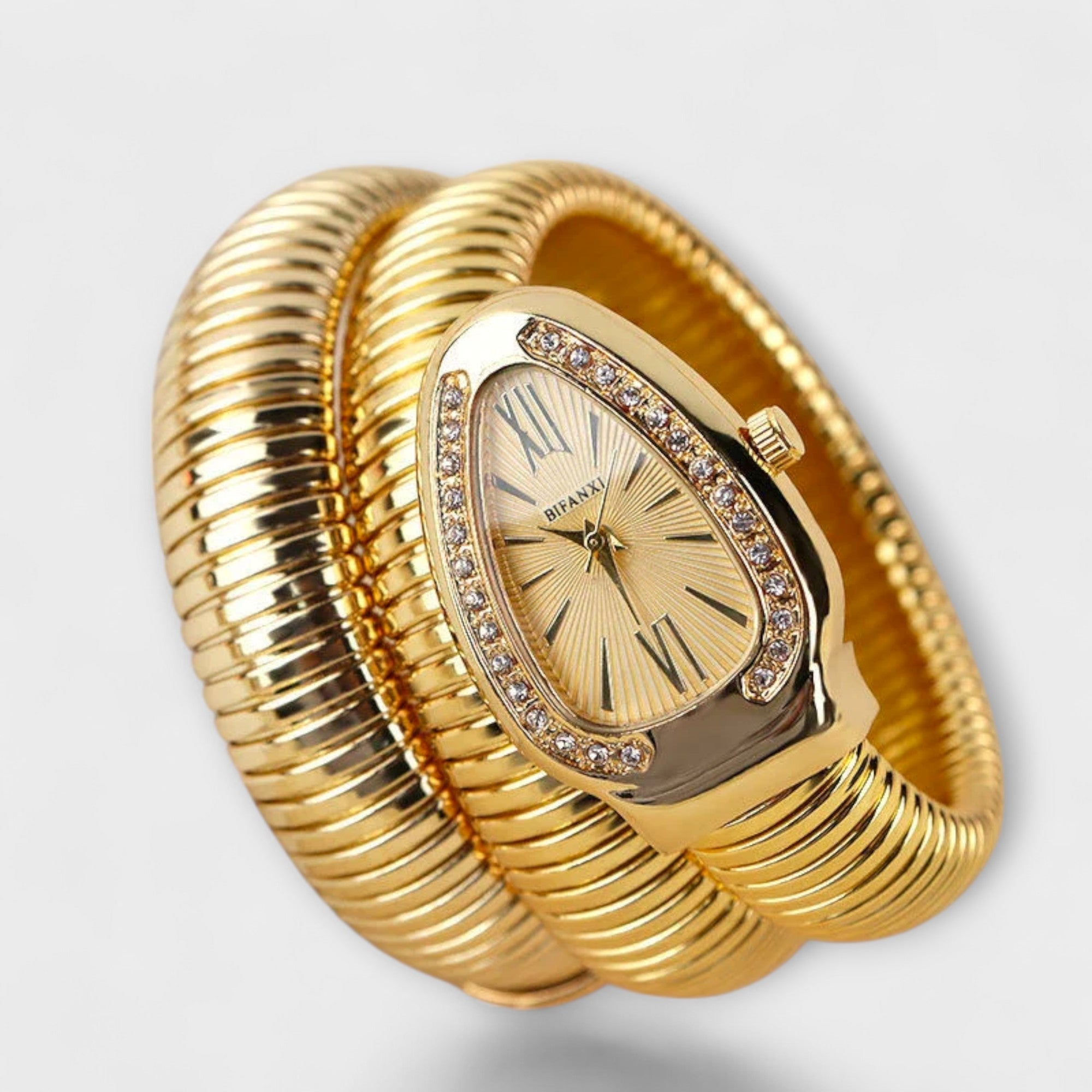 Women's gold snake-pattern watch with a glossy face and mesh bracelet strap