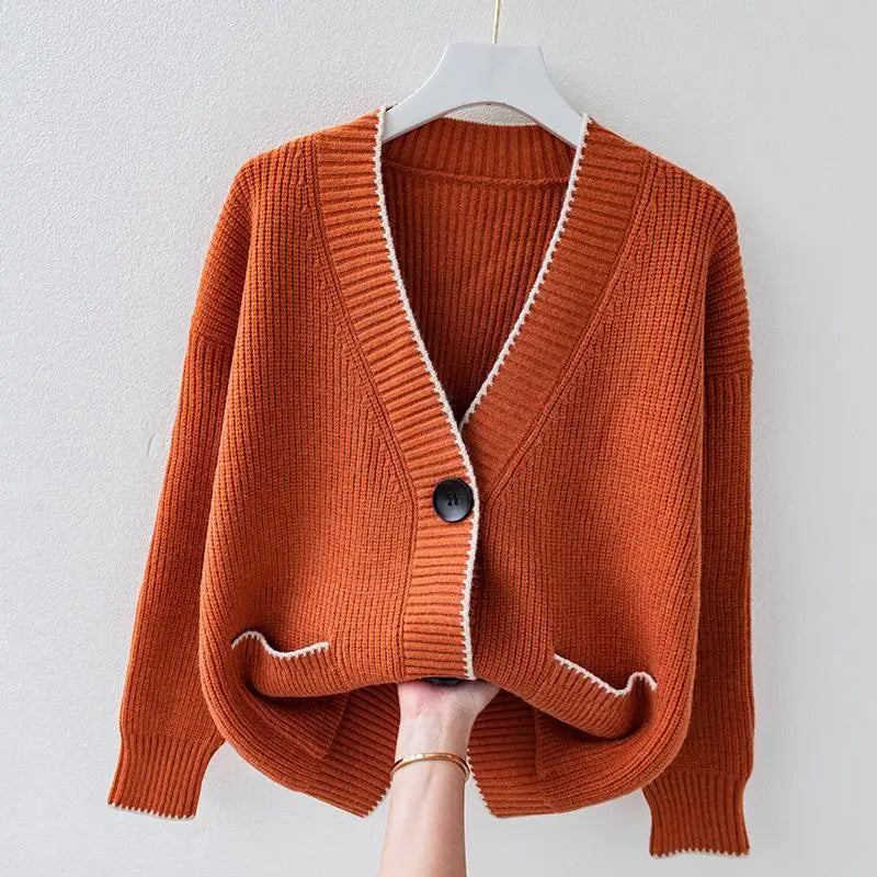 Oversized braided cardigan in beige, orange and navy blue with a relaxed open-front silhouette
