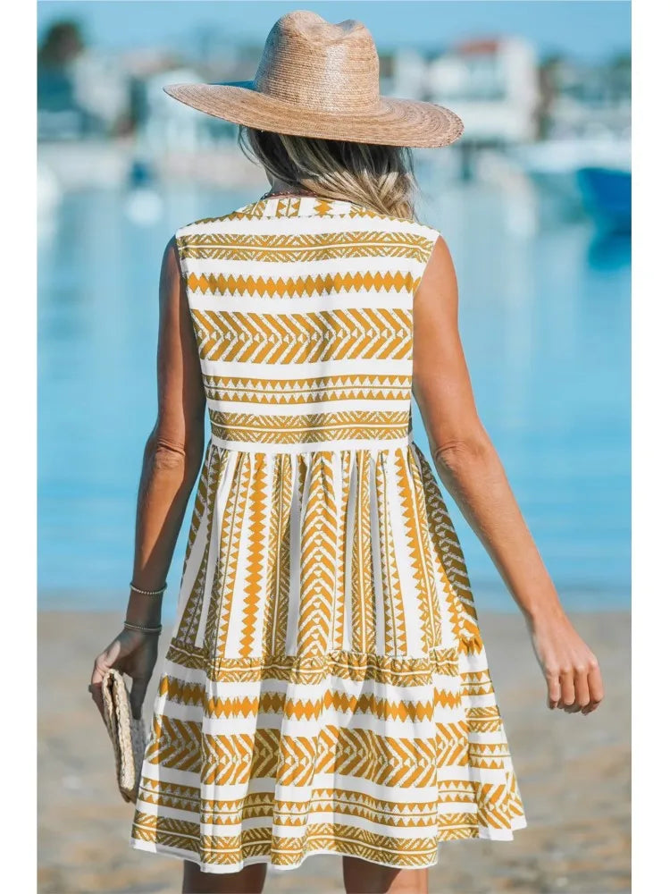 Woman in a geometric print A-line summer dress enjoying a sunny day out.