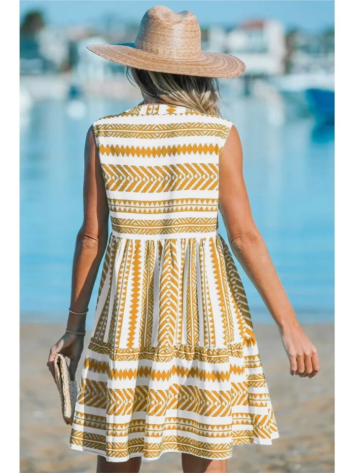 Woman in a geometric print A-line summer dress enjoying a sunny day out.