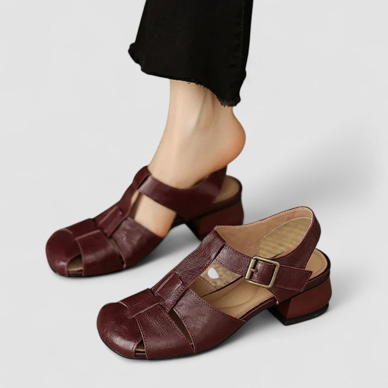 A woman in beige Mary Jane shoes with an ankle strap, comfortable browsing a market.