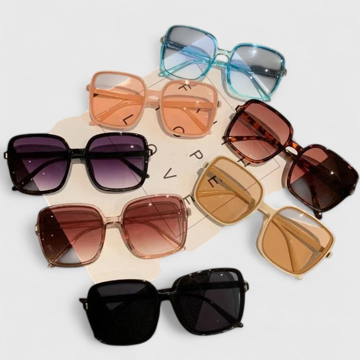 A woman running errands in town wearing classic square sunglasses, calm and stylish.
