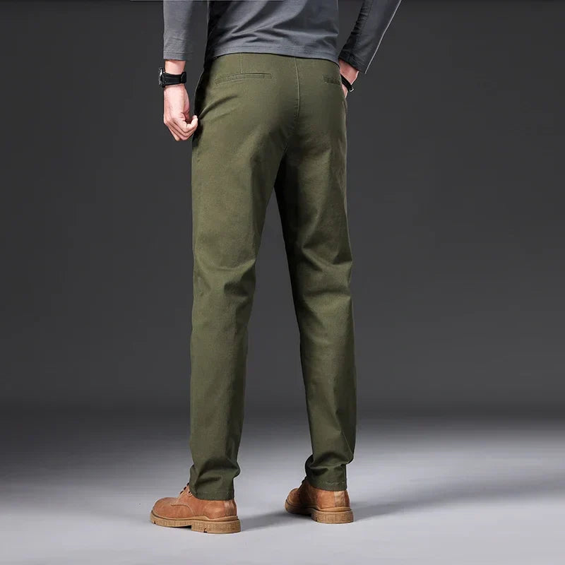 Men's casual trousers in black, blue, dark grey and beige with a relaxed, clean silhouette