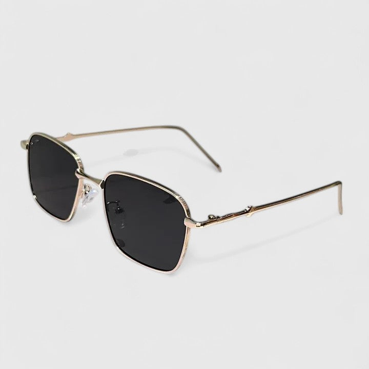 A woman on a sunny street wearing classic square gradient sunglasses, confident and stylish.