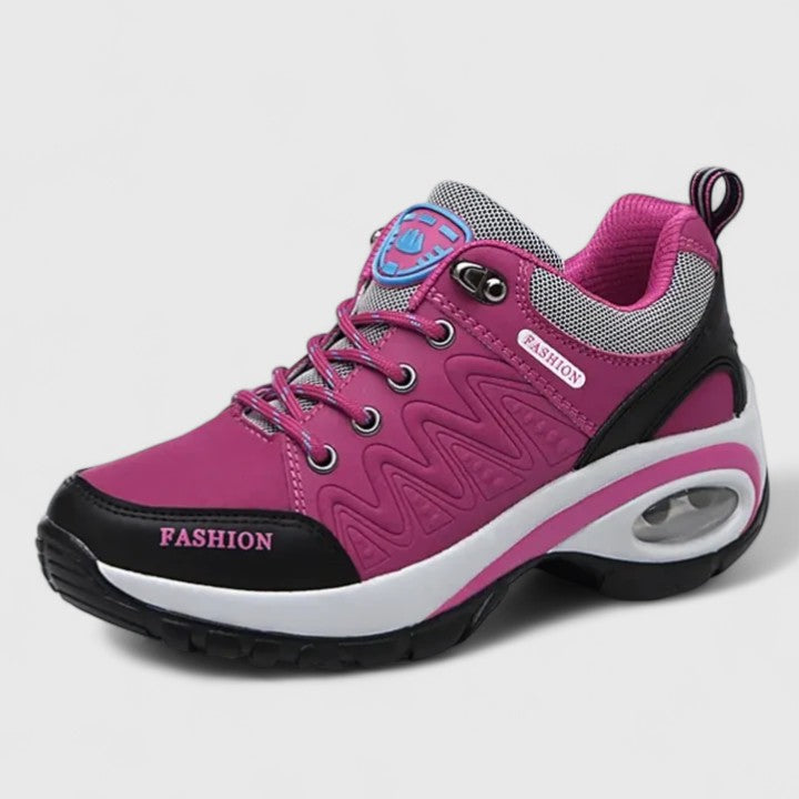 A woman wearing water-resistant comfort trainers on a wet winter day