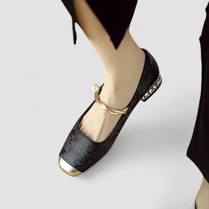 A woman wearing embellished green Mary Jane flats at a special occasion.