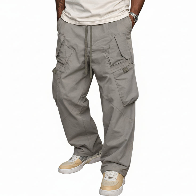 Men's grey cargo trousers with multiple pockets and a relaxed fit