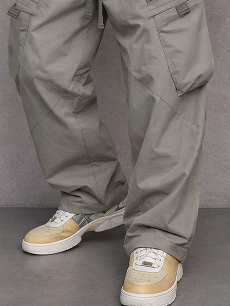 Men's grey cargo trousers with multiple pockets and a relaxed fit