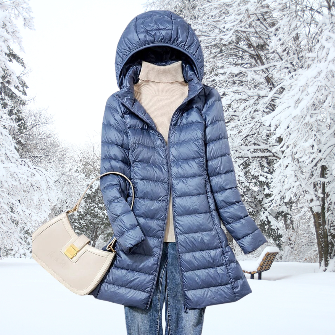 A woman wearing a lightweight weatherproof jacket with a detachable hood on a changeable day.