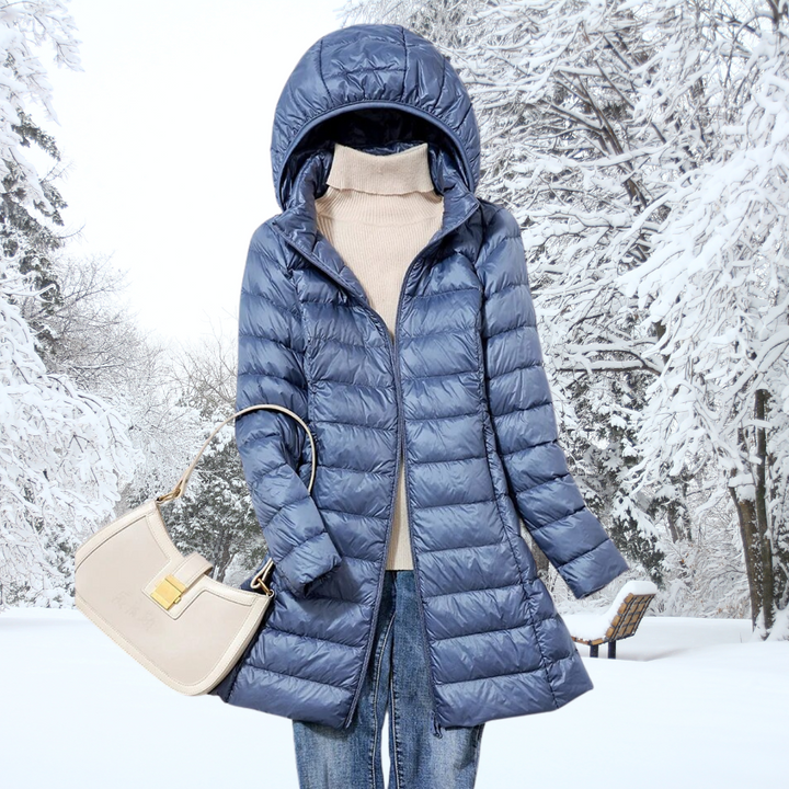 A woman wearing a lightweight weatherproof jacket with a detachable hood on a changeable day.