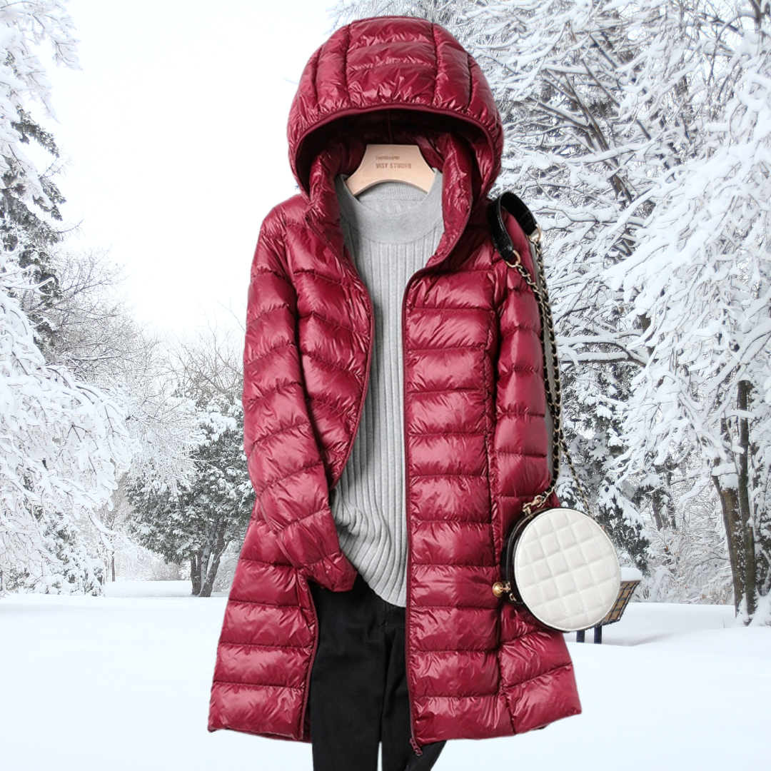 A woman wearing a lightweight weatherproof jacket with a detachable hood on a changeable day.