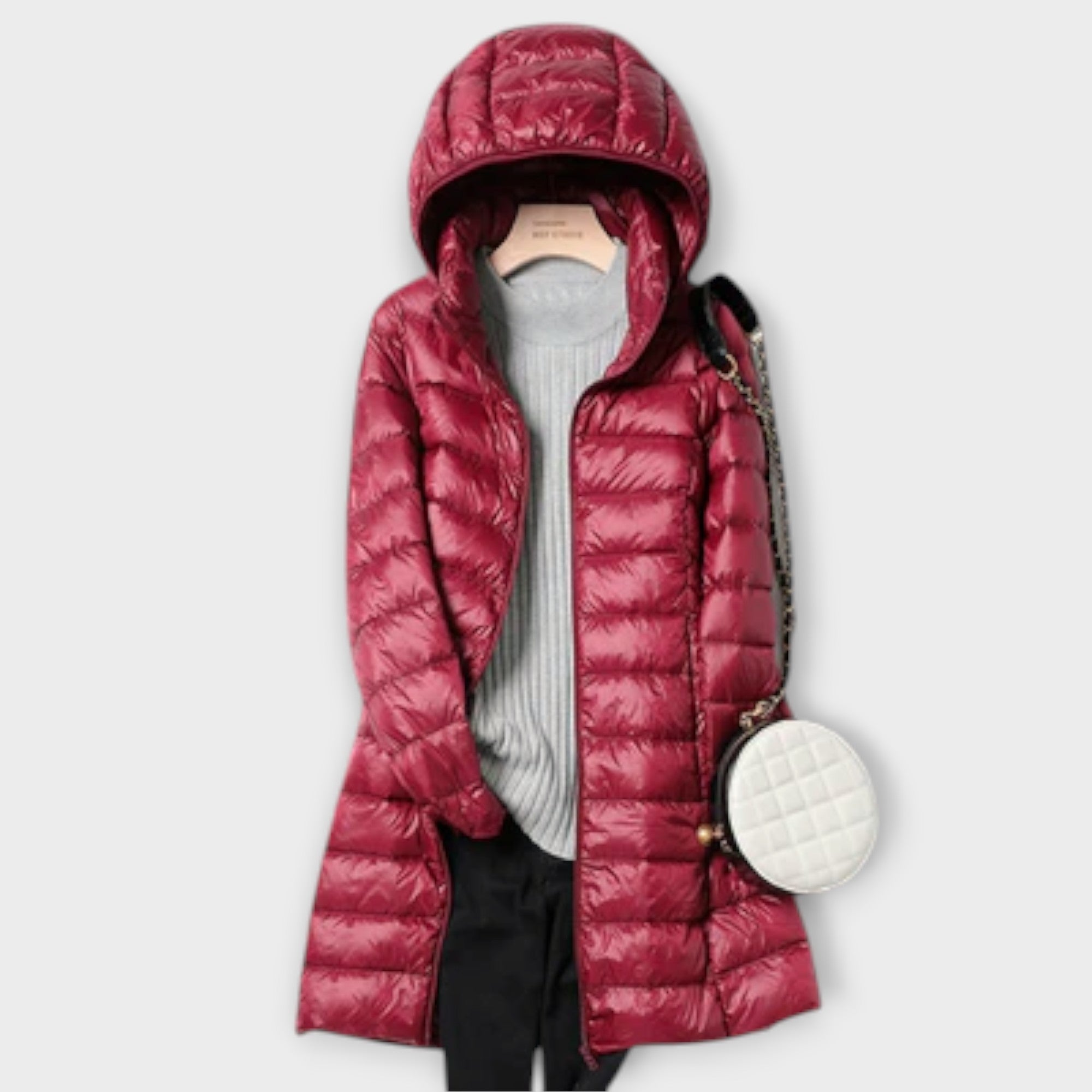 Ultralight padded coat in champagne, blue, pink and black with a sleek, modern silhouette