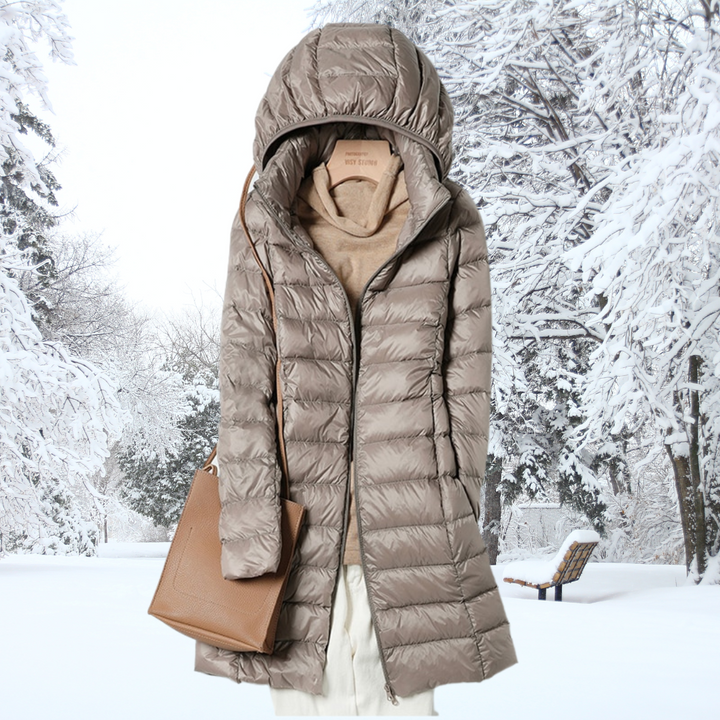 A rail of ultra-light padded hooded coats in pink, red, khaki and black, knee-skimming in length.