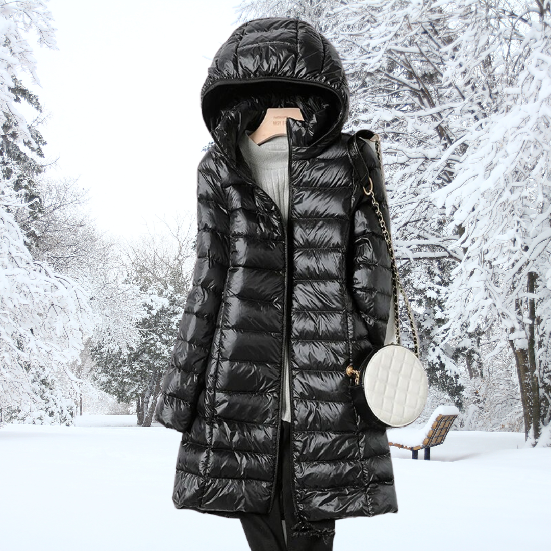 A woman wearing a lightweight weatherproof jacket with a detachable hood on a changeable day.