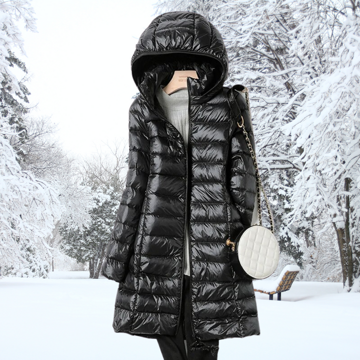 A woman wearing a lightweight weatherproof jacket with a detachable hood on a changeable day.