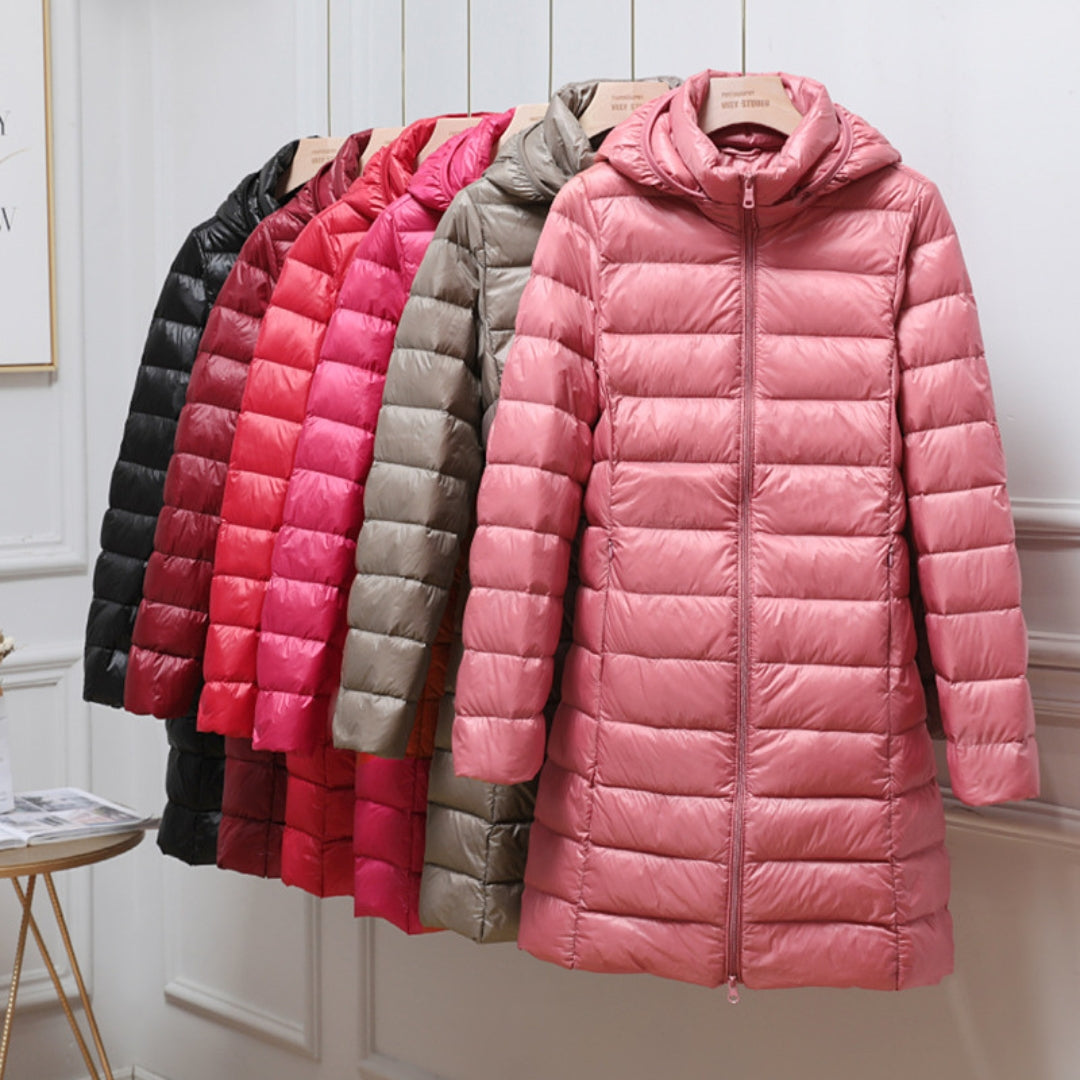 A woman wearing a lightweight weatherproof jacket with a detachable hood on a changeable day.