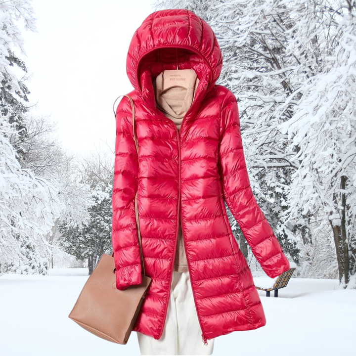 A woman wearing a lightweight weatherproof jacket with a detachable hood on a changeable day.