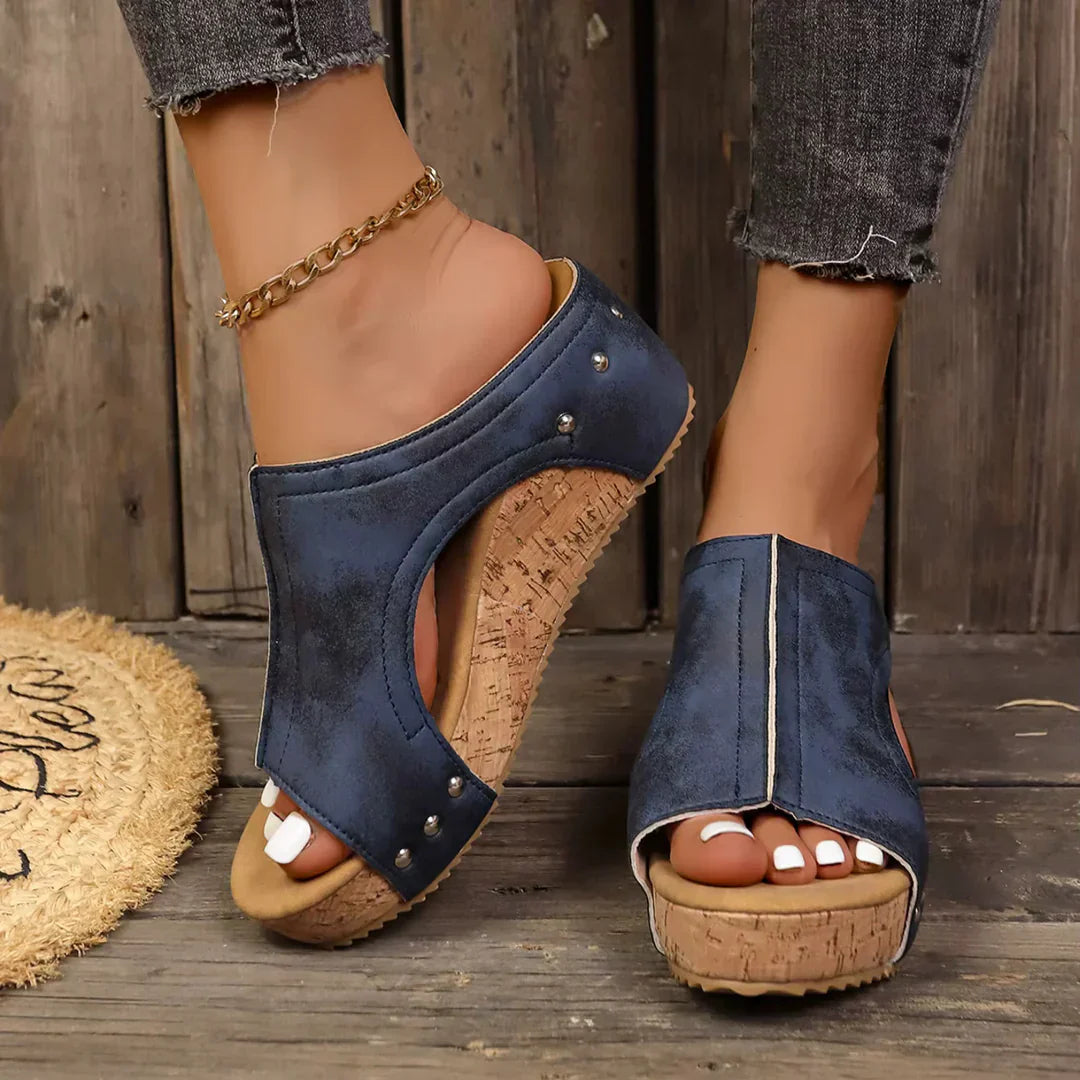 Backless wedge sandals with open-work upper in a natural beige tone