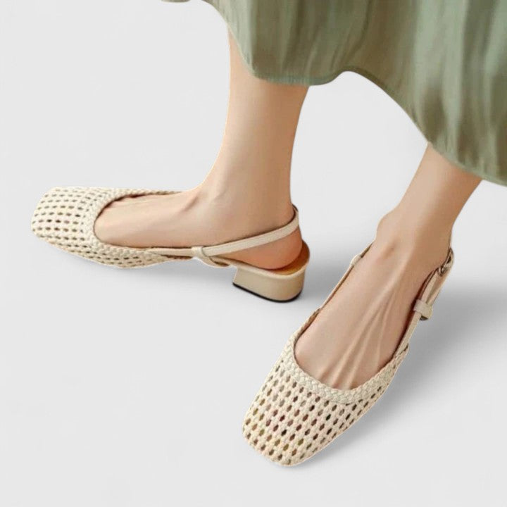 A woman wearing woven ballet flats with a square toe on an easy day out.