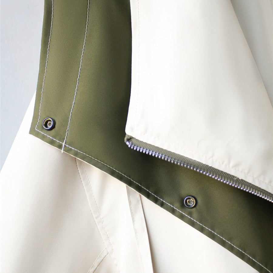A woman wearing a lightweight weatherproof jacket with an adjustable hem on a blustery day.