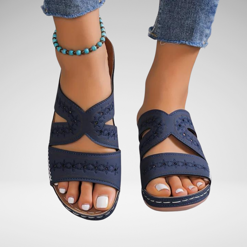 Women's crossover backless sandals with a cushioned footbed, shown in multiple summer colours