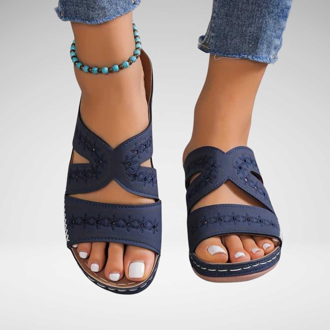 Women's crossover backless sandals with a cushioned footbed, shown in multiple summer colours
