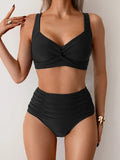 High-waist draped bikini in dark navy with gathered waistband detail