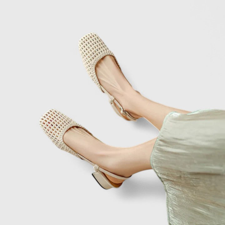 A woman wearing woven ballet flats with a square toe on an easy day out.