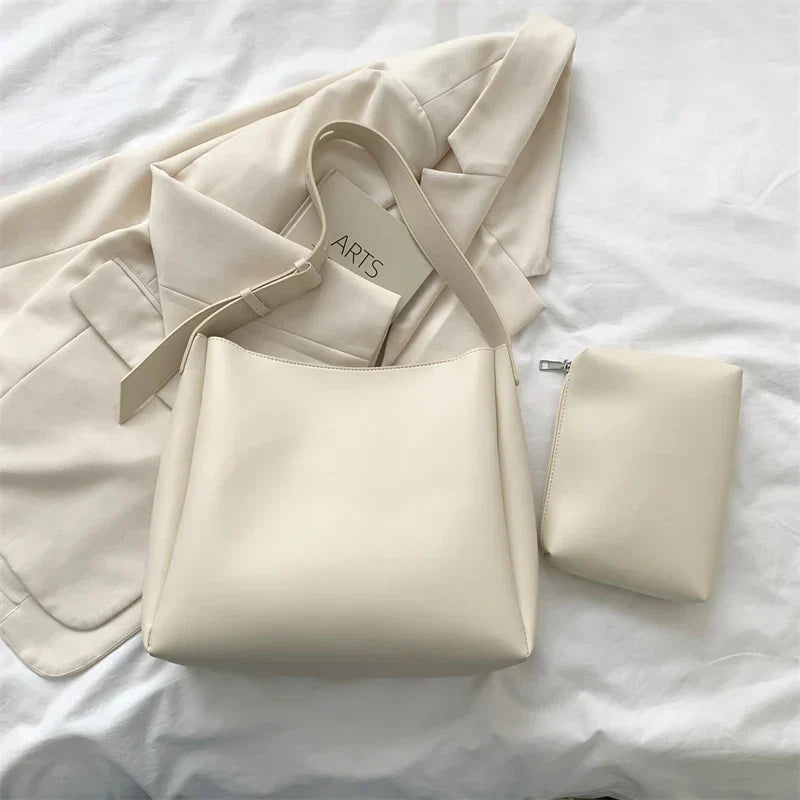 Elegant structured tote bag in black with clean minimalist lines and comfortable shoulder strap