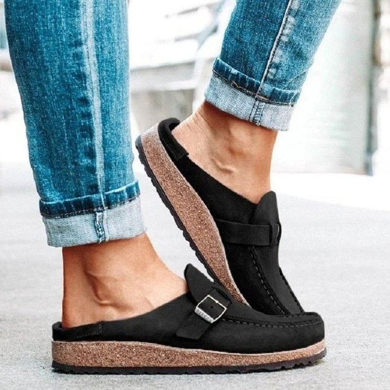 Taupe backless clogs with closed toe and adjustable buckle strap