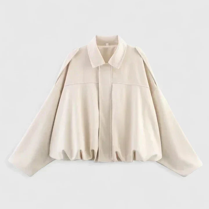 A woman wearing a classic versatile jacket, styled for a smart-casual day out.