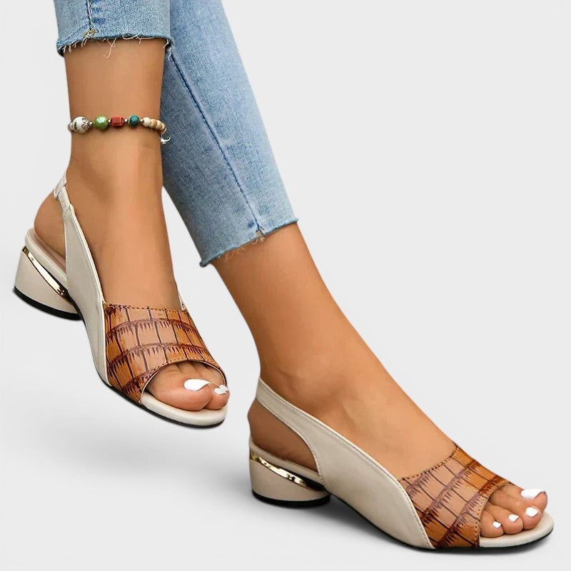 Women's peep-toe wedge sandals in red with an open toe and secure ankle strap