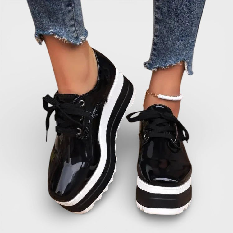 Women's platform trainers in beige with a cushioned sole and glossy contemporary finish