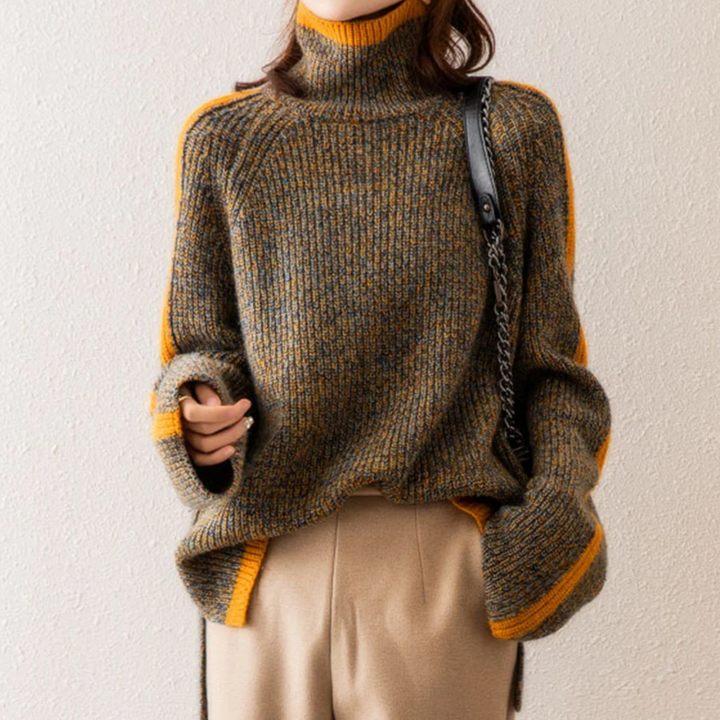 A woman wearing a softly textured everyday jumper with a relaxed modern line.