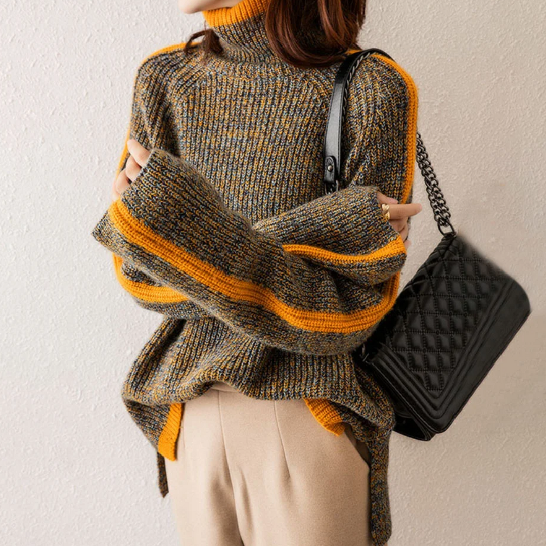 A woman wearing a softly textured everyday jumper with a relaxed modern line.