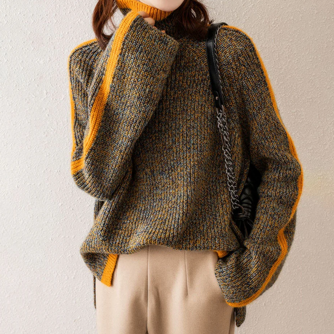 A woman wearing a softly textured everyday jumper with a relaxed modern line.