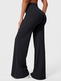 Black high-waisted power flare leggings with a contoured back seam and wide flared leg