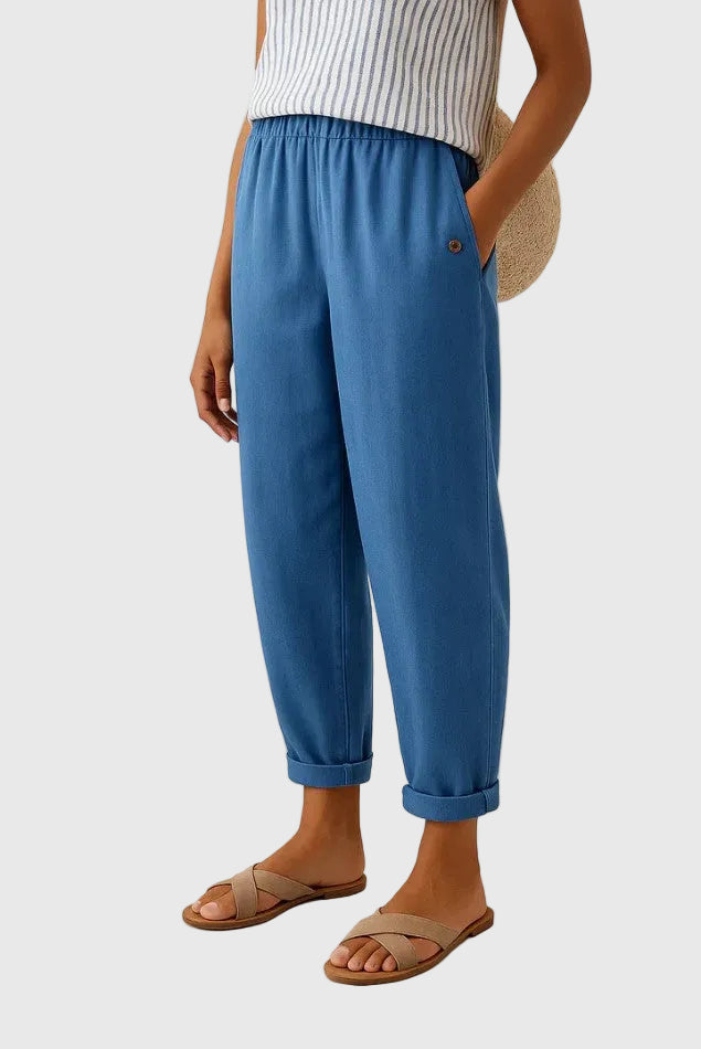 A woman wearing chic comfy trousers with a modern relaxed cut and flattering silhouette.