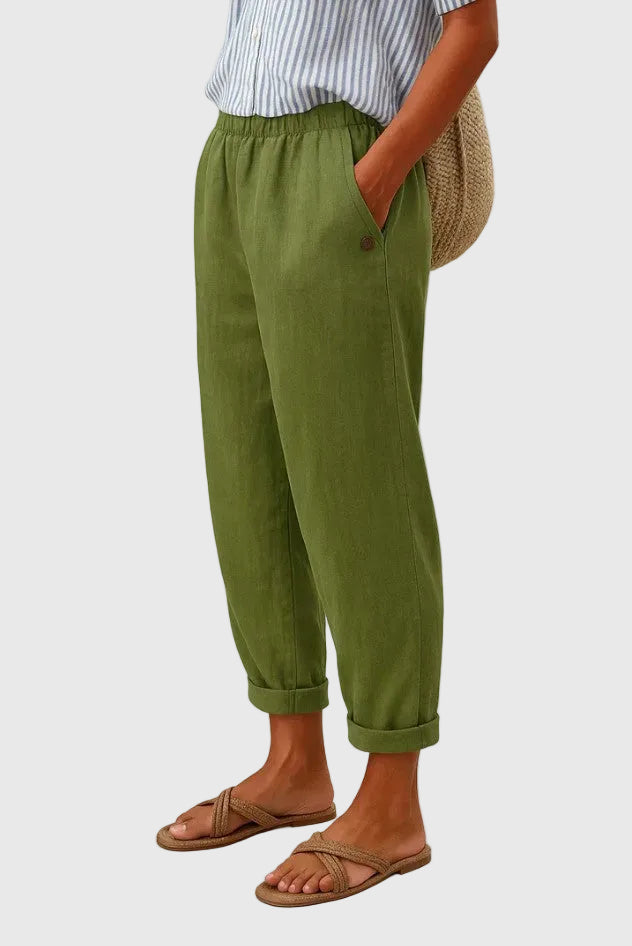 A woman wearing chic comfy trousers with a modern relaxed cut and flattering silhouette.