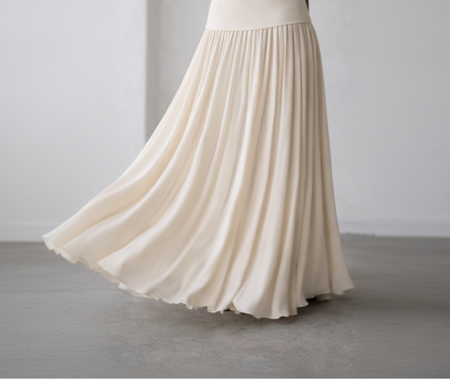 Elegant dress with a structured bodice and pleated skirt in beige, also available in pink, black, light blue and pale yellow