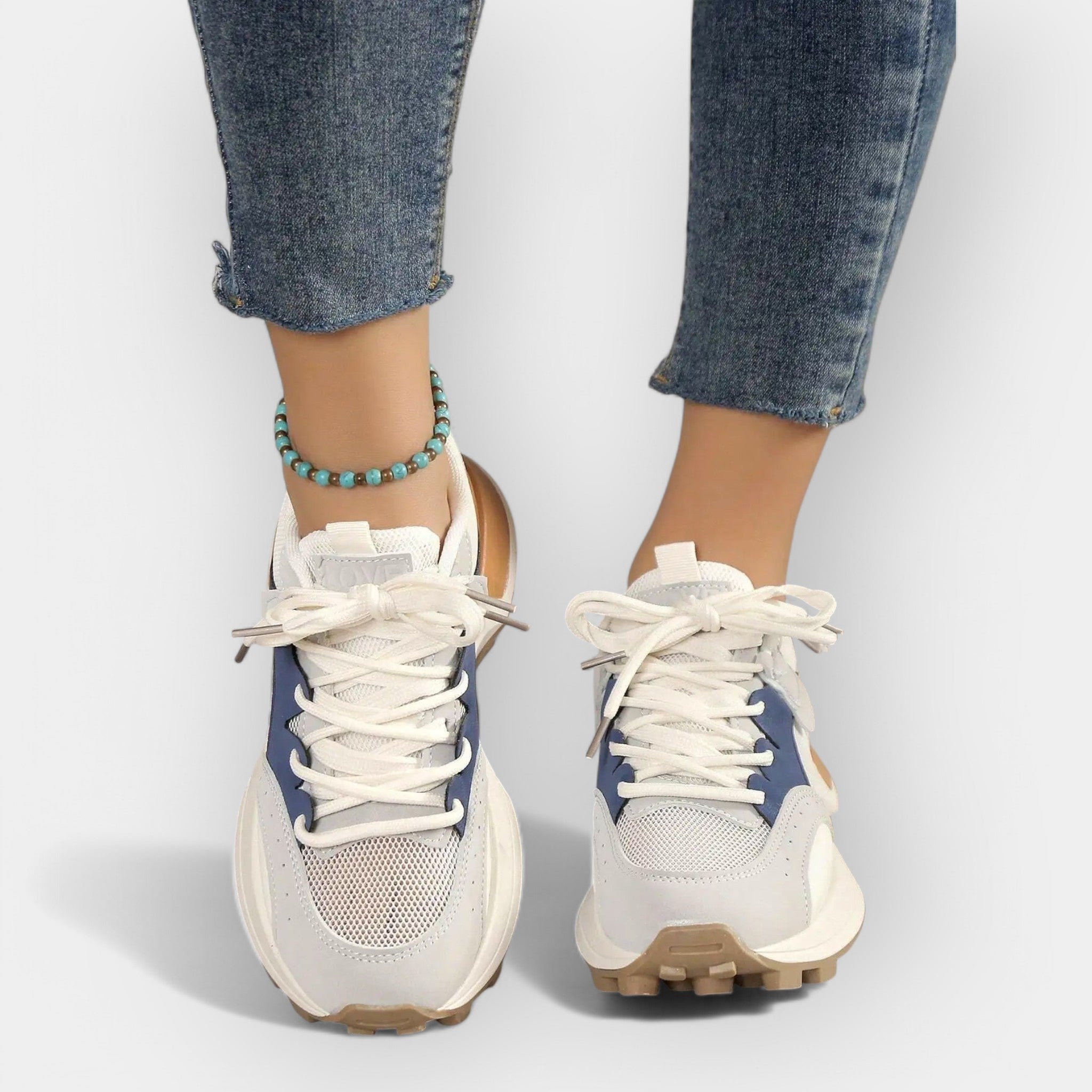 Women's ergonomic daily trainers with cushioned sole in a modern clean design