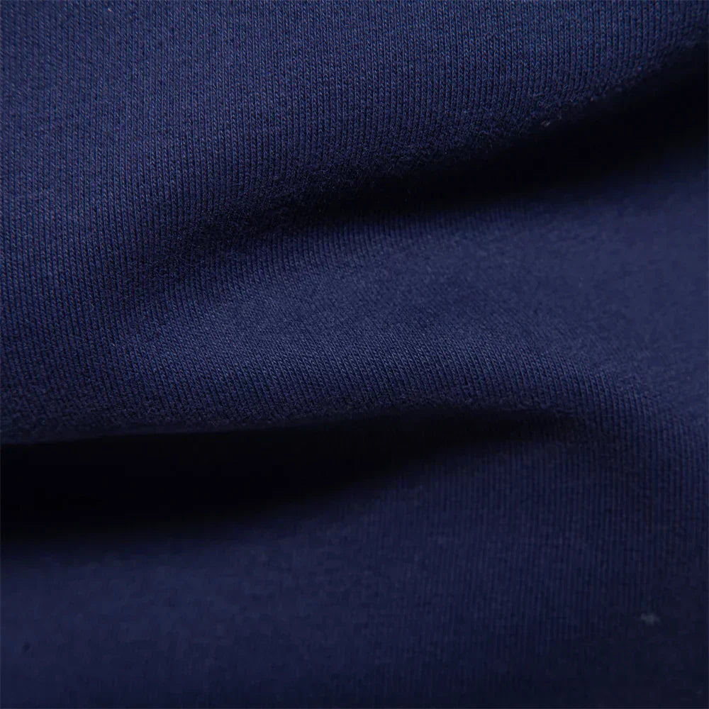 Men's contrast polo jumper in black with classic collar and button placket