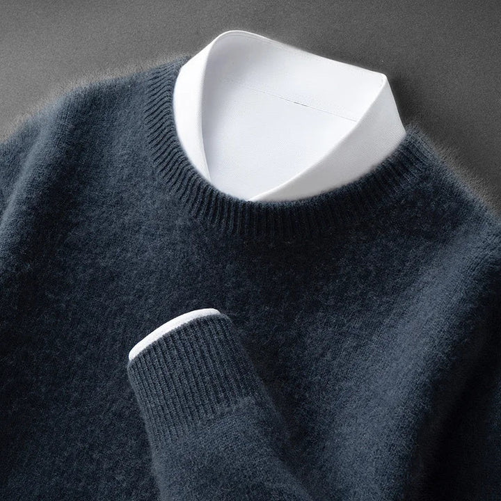 A woman wearing a soft warm jumper layered over a shirt on a cold day.