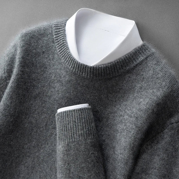 A woman wearing a soft warm jumper layered over a shirt on a cold day.