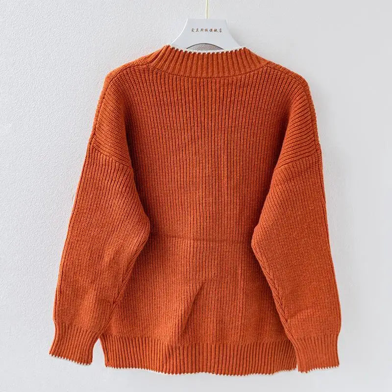 Oversized braided cardigan in beige, orange and navy blue with a relaxed open-front silhouette
