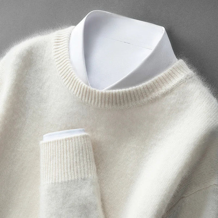 A woman wearing a soft warm jumper layered over a shirt on a cold day.