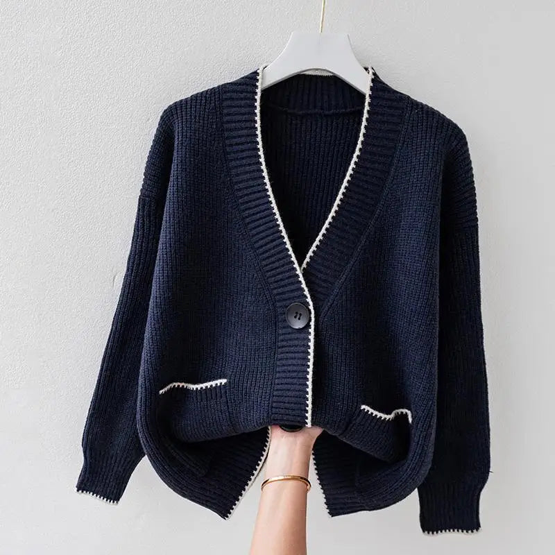 Oversized braided cardigan in beige, orange and navy blue with a relaxed open-front silhouette