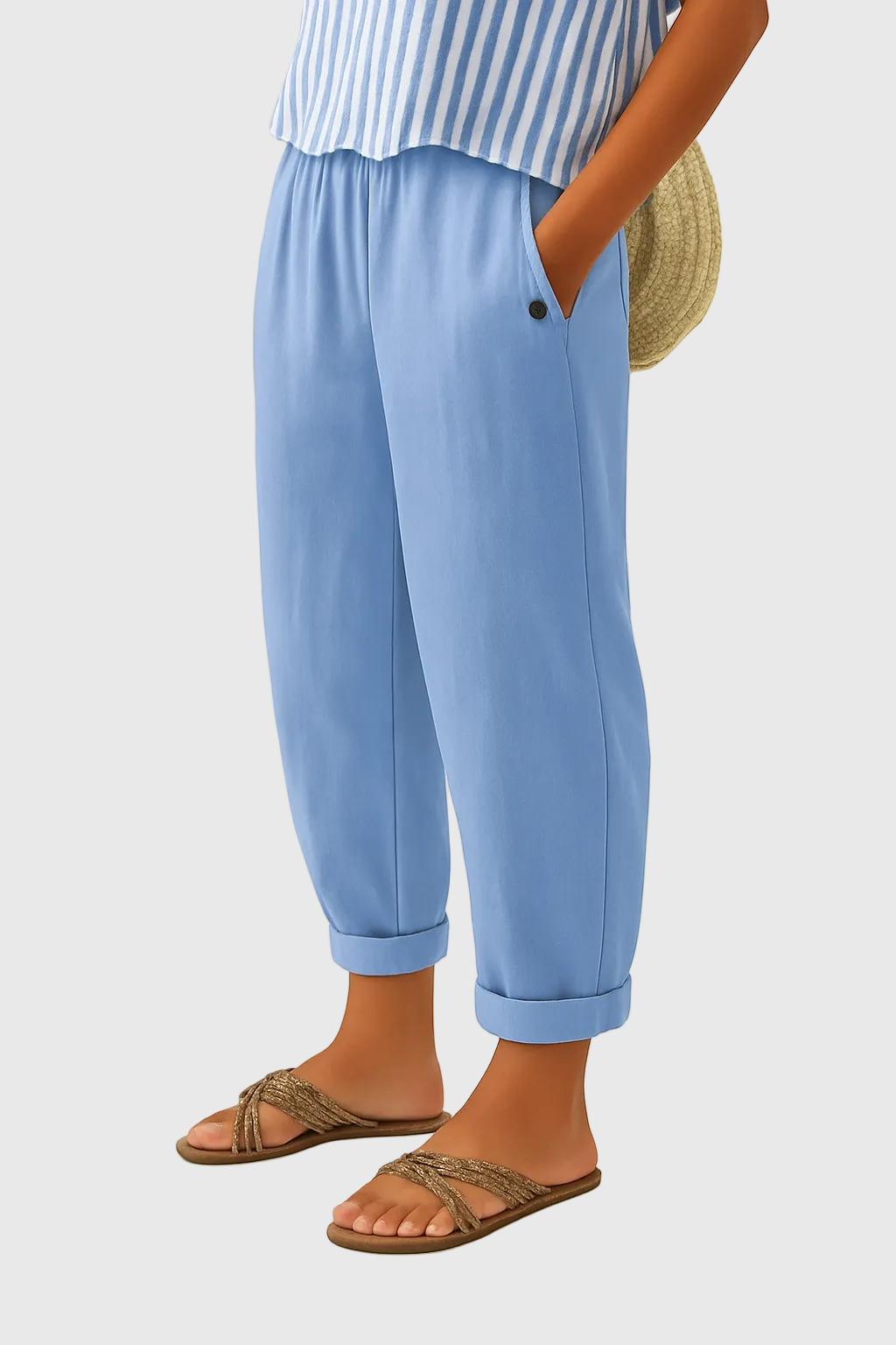 A woman wearing chic comfy trousers with a modern relaxed cut and flattering silhouette.
